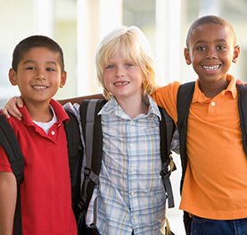 three boys smiling