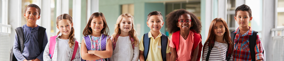 students ready for school carrying backpacks